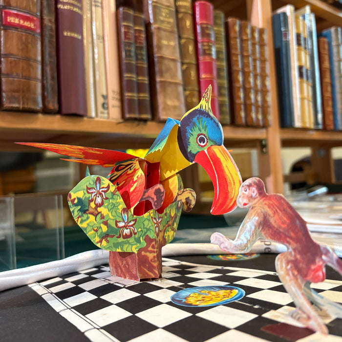 Edinburgh book fair image showing a pop-up book with shelves of books in the background