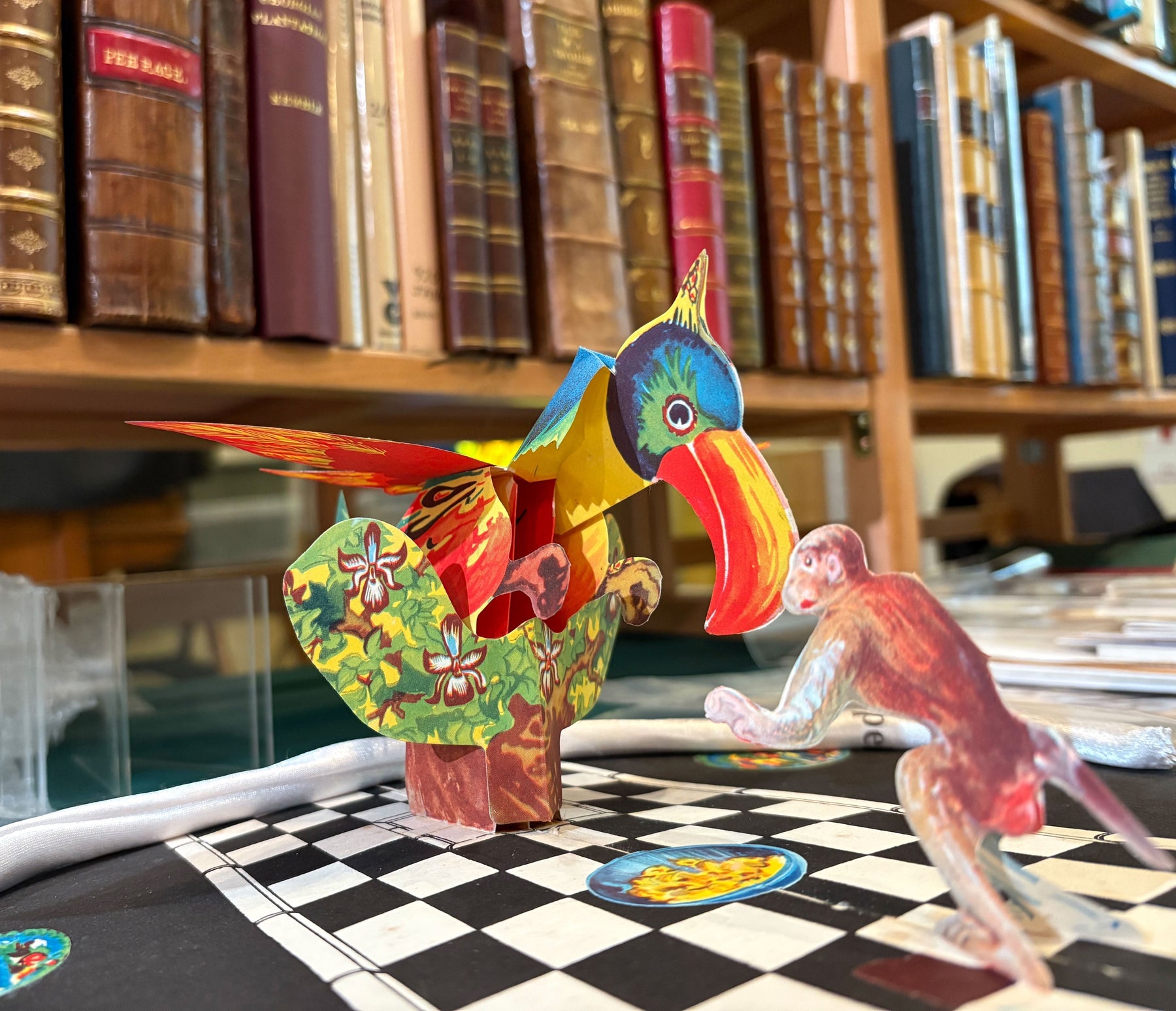 Edinburgh book fair image showing a pop-up book with shelves of books in the background