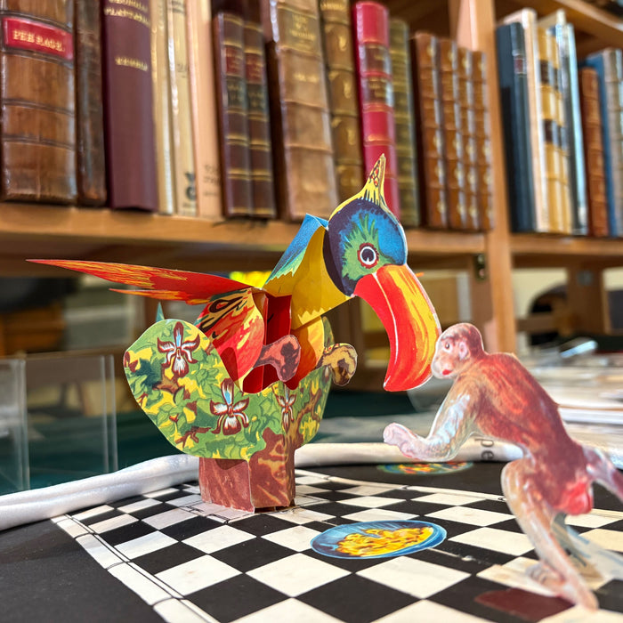 Edinburgh book fair image showing a pop-up book with shelves of books in the background