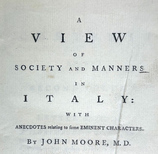 A vintage book or pamphlet cover with black serif text printed on aged off-white paper. The title reads: 'A VIEW OF SOCIETY AND MANNERS IN ITALY: WITH ANECDOTES relating to some EMINENT CHARACTERS.