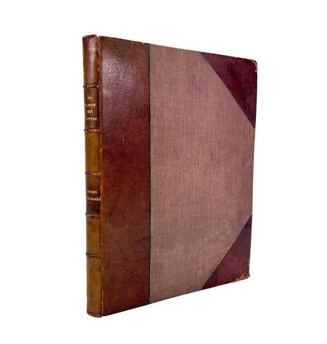 Vintage leather-bound book on a white background
