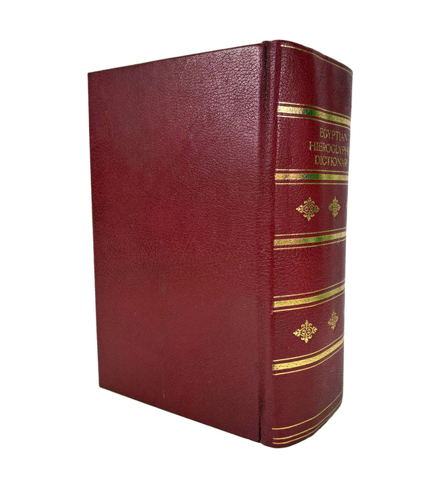 A vintage hardcover book with a textured burgundy leather cover and gold foil detailing on the spine, photographed against a plain white background.