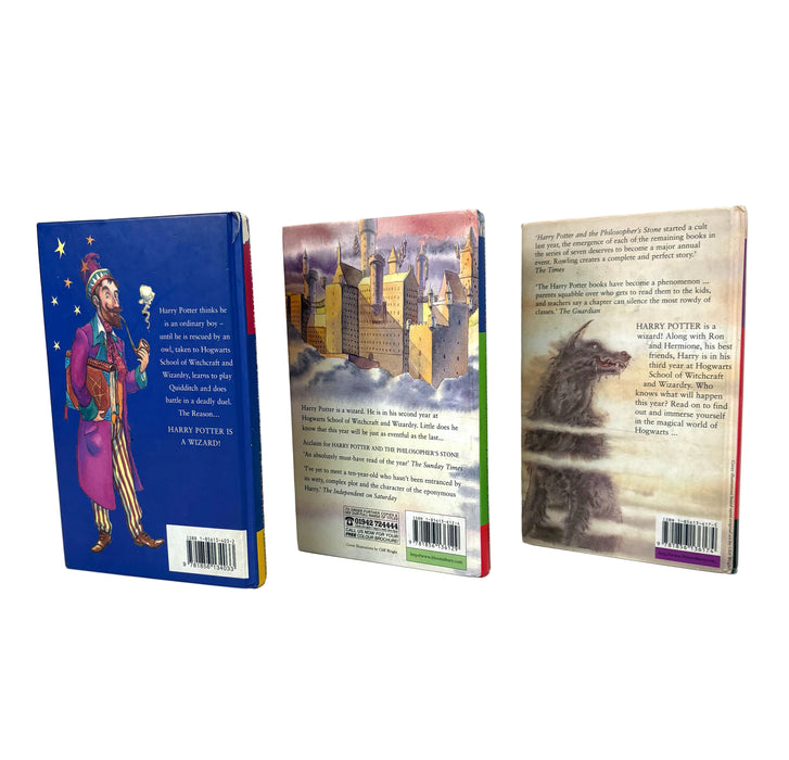 Three Harry Potter book back covers displayed upright on a white studio background, showing the blue cover with a wizard illustration, a silver-and-white cover with castle artwork, and a beige cover with a creature illustration.