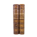 Two leather-bound books titled 'History of the Commonwealth' by Arnold on a white background