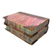 Stack of vintage books with colorful cloth bindings on a white background