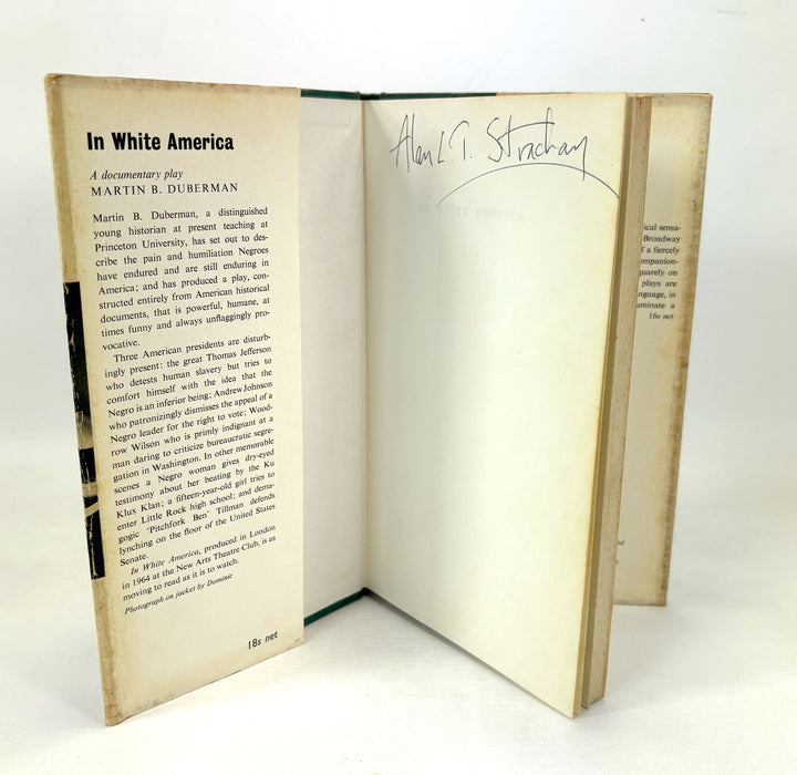 An open vintage hardcover book titled 'In White America' by Martin B. Duberman, showing the printed text pages and a handwritten signature on the inner cover, photographed against a plain white background.