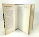 An open vintage hardcover book titled 'In White America' by Martin B. Duberman, showing the printed text pages and a handwritten signature on the inner cover, photographed against a plain white background.
