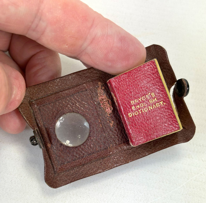 Miniature Book; Bryce's English Dictionary; The Smallest English Dictionary in the World, David Bryce, Glasgow, c. 1900. Pears promotional issue with original magnifying leather wallet