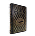 A vintage hardcover edition of Herman Melville's Moby Dick, featuring a black leather-like cover with ornate gold foil wave patterns and gold lettering, shown standing upright on a white background.