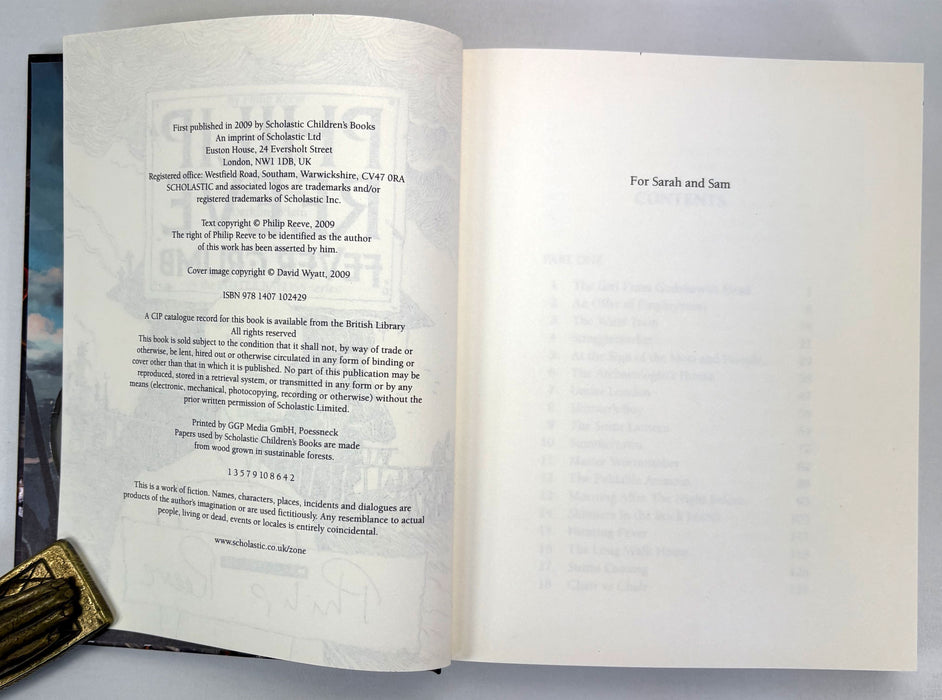 Philip Reeve; Fever Crumb; Signed/remarqued copy of this Mortal Engines novel, with postcard, first printing