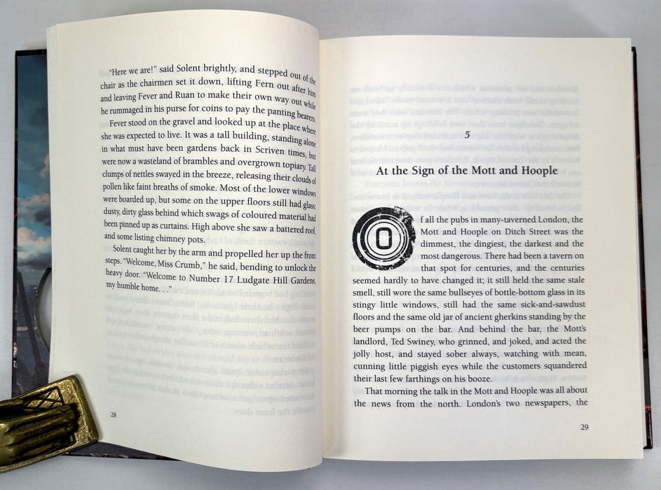 Philip Reeve; Fever Crumb; Signed/remarqued copy of this Mortal Engines novel, with postcard, first printing