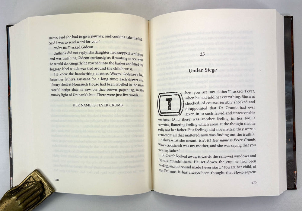 Philip Reeve; Fever Crumb; Signed/remarqued copy of this Mortal Engines novel, with postcard, first printing