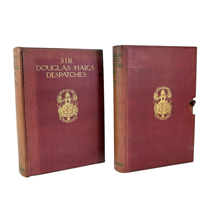 Two vintage hardcover books of Sir Douglas Haigs Despatches, featuring maroon cloth covers with gold-foiled lettering and crest emblems, displayed on a white background.