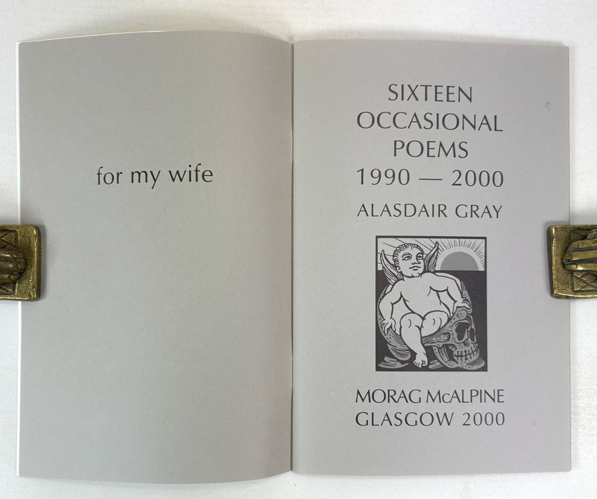 An open book or booklet showing printed cover pages with the title 'SIXTEEN OCCASIONAL POEMS 1990 — 2000' and author 'ALASDAIR GRAY,' plus 'for my wife' on the left page and 'MORAG McALPINE GLASGOW 2000' on the right page. The pages are light gray with black text and a small black-and-white illustration, photographed against a white background with brass-colored edge supports visible on both sides.