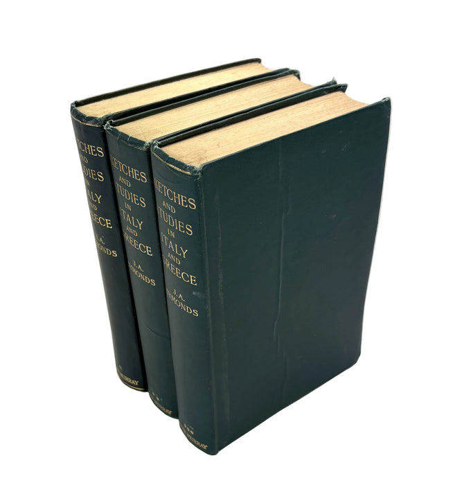 Three green books stacked on a white background