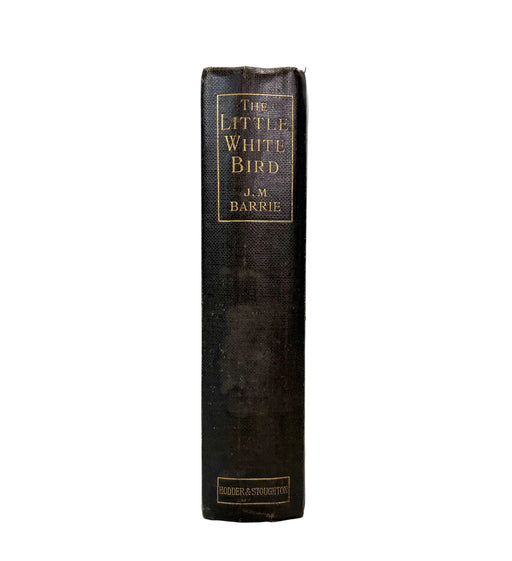 A vintage hardcover book, 'The Little White Bird' by J.M.