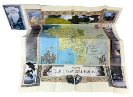 The map of Tolkien's Middle-earth playmat, fully unfolded to show its detailed design, accompanied by the map box and two small dragon figurines, set against a plain light background.
