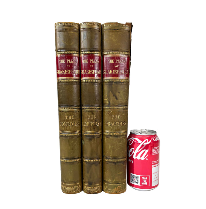 Three vintage leather-bound Shakespeare quartos standing upright next to a red Coca-Cola can for scale, on a white background.