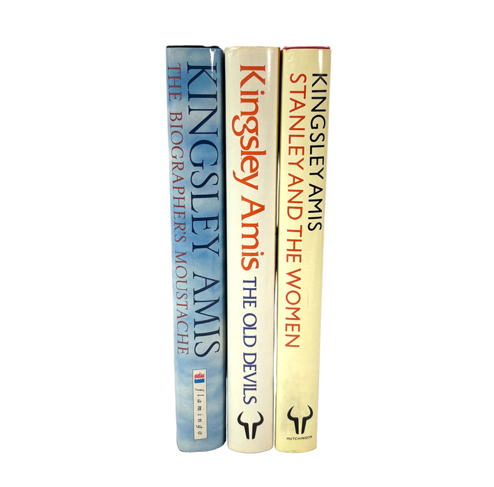 Three hardcover books standing upright side by side on a white background: Kingsley Amis The Biographer's Moustache (blue-gray), The Old Devils (cream), and Stanley and the Women (cream).