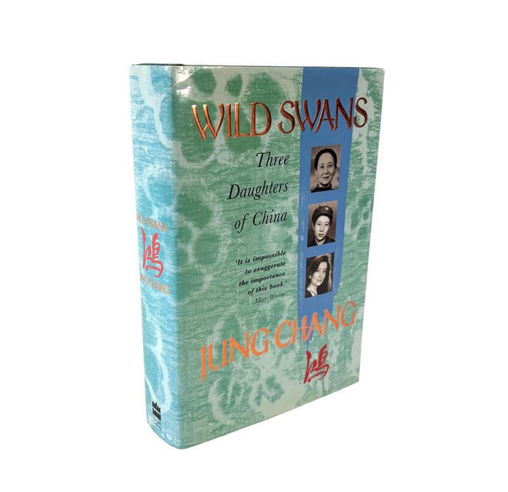 A hardcover book titled 'Wild Swans: Three Daughters of China' by Jung-chang, standing upright against a plain white background.