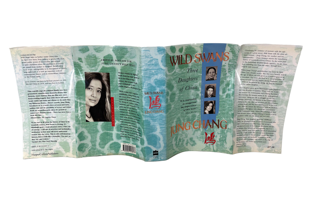 A vintage paperback book titled 'Wild Swans: Three Daughters of China' by Jung Chang, shown unfolded to display its front cover, back cover, and central spine panel against a plain white background.