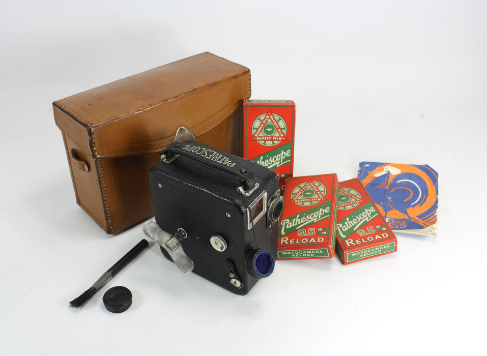 Vintage Pathescope Motocamera with unused film and accessories, c. 1930