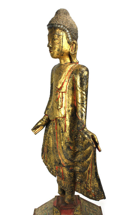 Burmese antique A large lacquered and gilt teakwood standing Buddha Burma