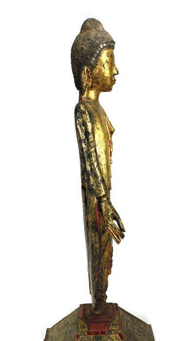 Burmese antique A large lacquered and gilt teakwood standing Buddha Burma