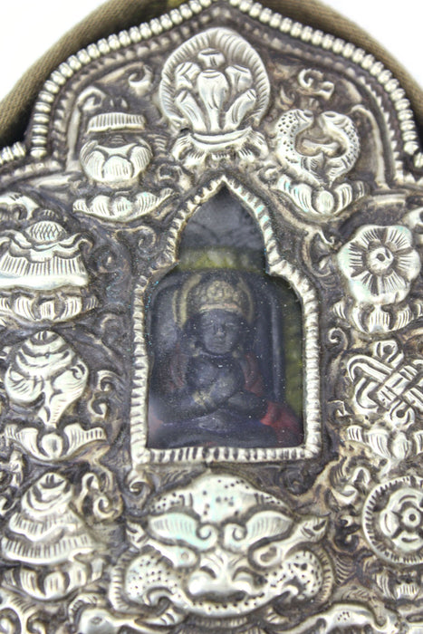 Tibetan Ghau amulet box containing Tsa Tsa