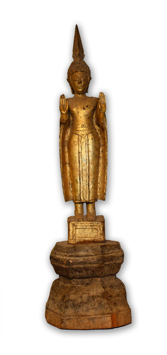 An elegant lacquer and gilt teakwood figure of standing Buddha, northern Thailand or Laos